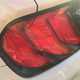 I actually really like the new tail lights and the bars on the deck lid panel. These match up to the surround much better